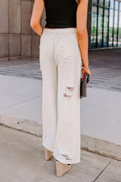 The Benett High Waist Distressed Pants In Ivory -Hanger Fashion 2202099408000 2023050813282800 faf538a6the benett high waist distressed pants in ivory